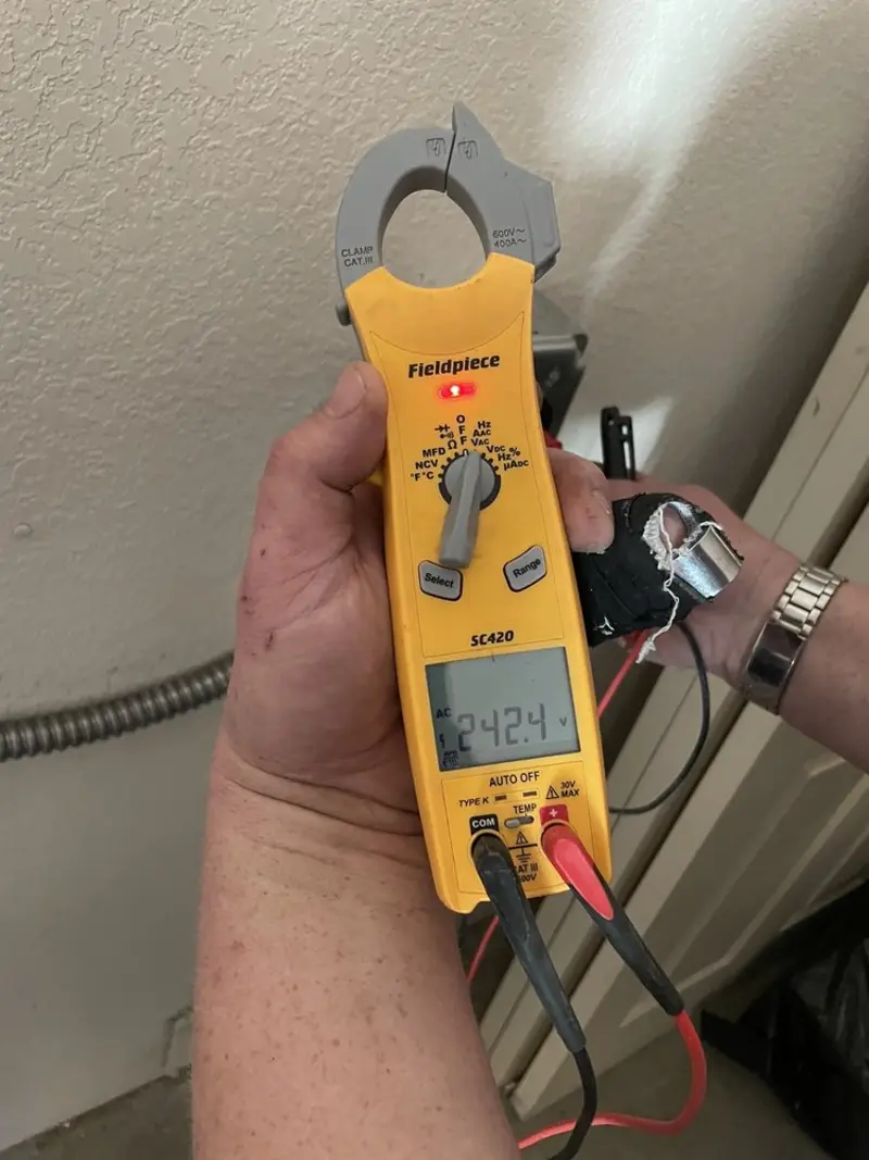 Voltage testing with clamp meter during Whole House Surge Protector in Meadow Lake